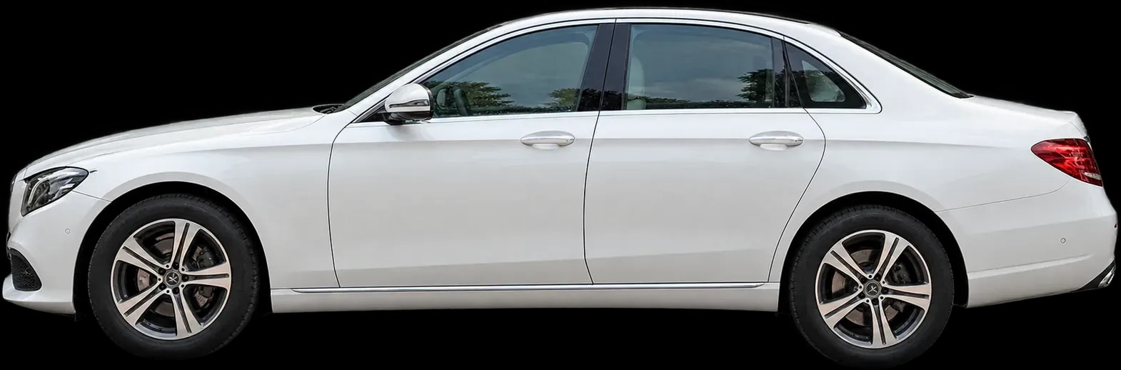 Mercedes-Benz E220d in white, side profile